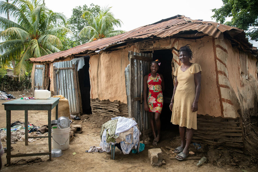 Antoinette Gredeon and her daughter in Malfeti after receiving WFP in-kind assistance, her house was severely affected by the floods.