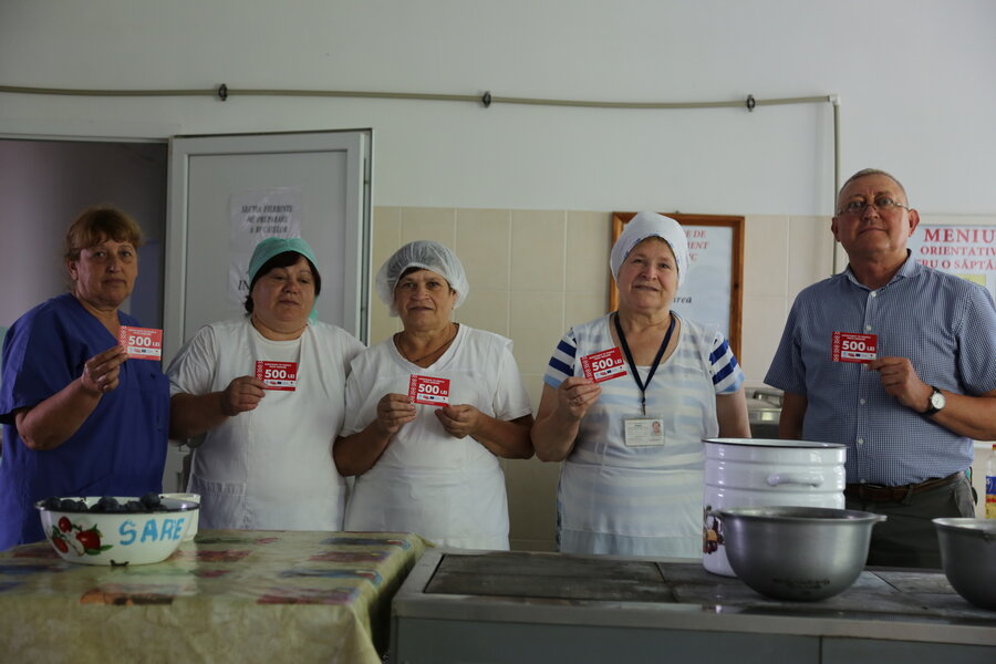 (L-R) Assistant kitchen manager Viorica, cooks Ecaterina and Maria, kitchen manager Tatiana and centre manager Vasile. Photo: WFP/Kyle Wilkinson