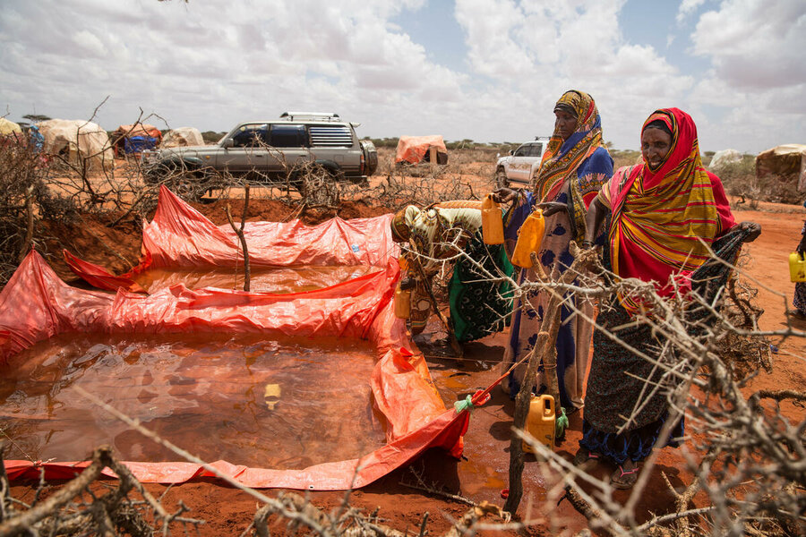 People collect water at a camp for the displaced in Gaxandhale in 2019. WFP/Kevin Ouma