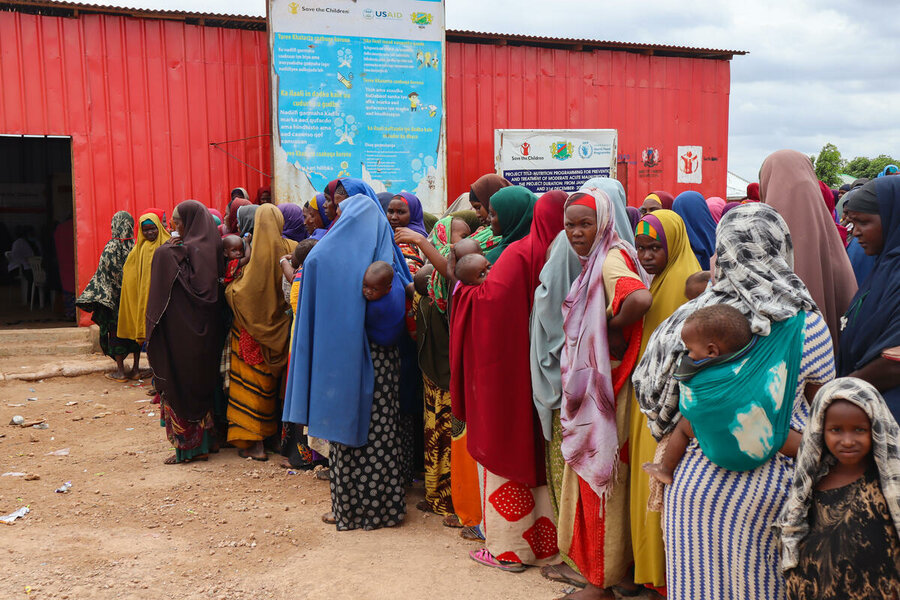 People wait in line for assistance at a WFP-supported camp in Baidoa. Photo: Geneva Costopulos