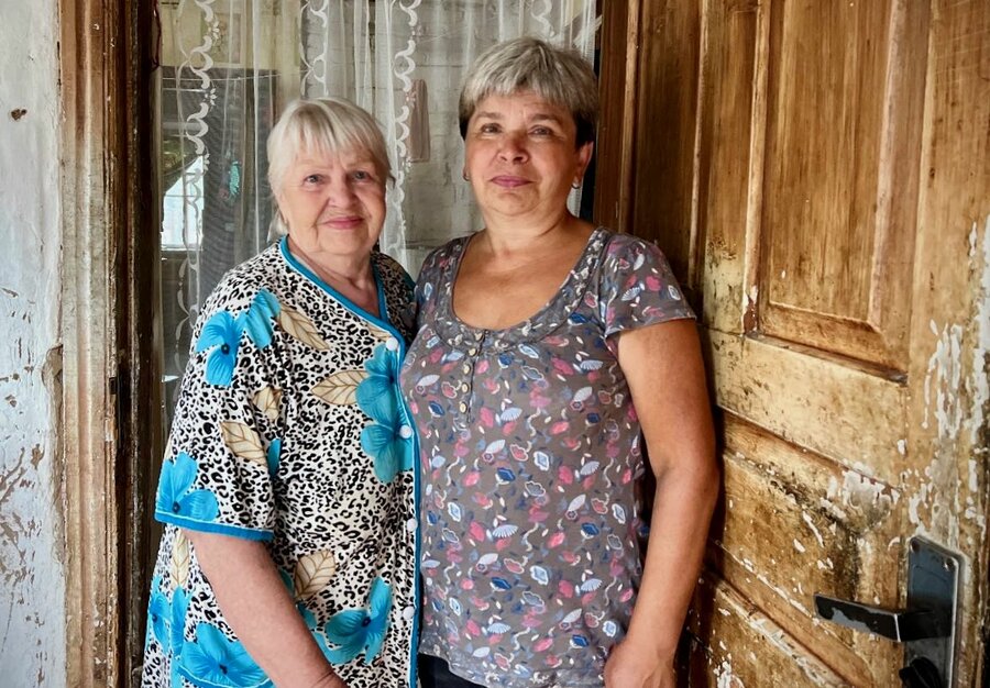 Natalia (R) and her mother-in-law at their home. 