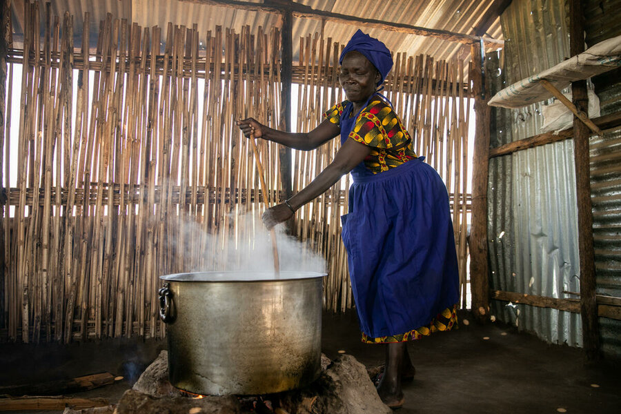 Suzan Henery Arkangelo cooking lunch at Torit Model Primary School, South Sudan