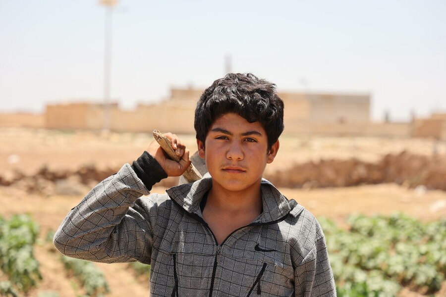 The drought in Syriaa. Jihad, the young boy stands near the field