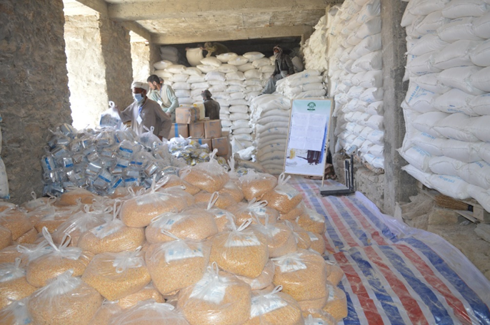 Food stocks at a distribution site. In 2022, WFP distributed more than 1 million metric tons of food to hungry people, thanks to support from partners like the European Union. WFP/Ziauddin Safi