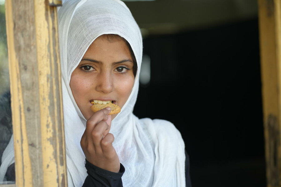 Afghanistan schoolgirl Hazra, 11, enjoys WFP's energy-packed biscuits and hopes to becomes a doctor when she grows up. Photo: WFP/Sadeq Naseri