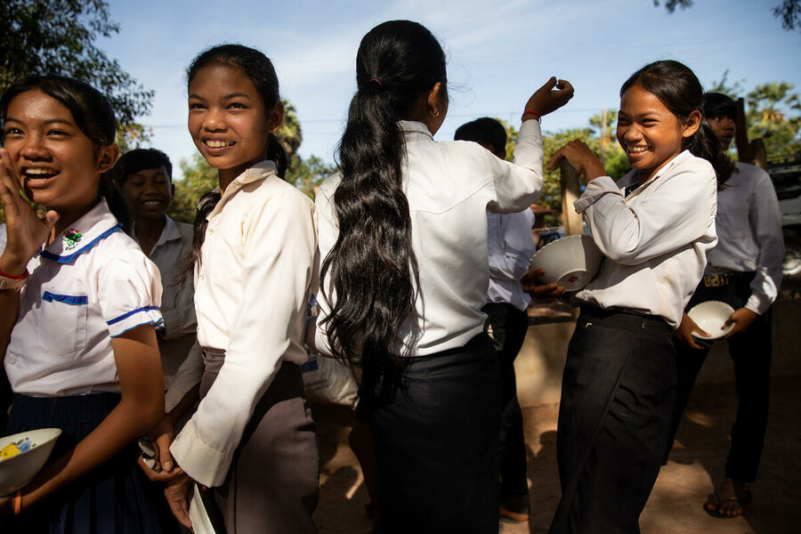 Girls wait in line for their school meals at Bos Thom. Photo: WFP/Samantha Reindeers