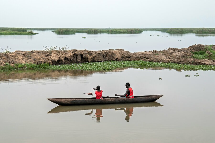 Two boys fish in Jalle, South Sudan, a country on the frontlines of the climate crisis. Photo: WFP/Alessandro Abbonizio