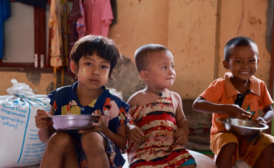 Children enjoy WFP food in Myanmar's cyclone-hit Rakhine State. Photo: WFP/Su Myat Yadanar