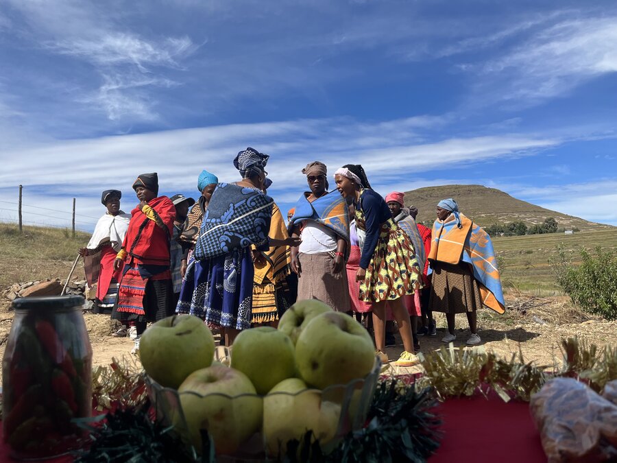People show off their produce in a village in Lesotho - Peyvand Khorsandi