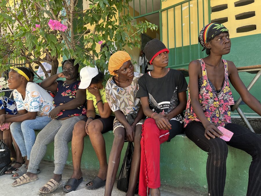 People wait to redeem vouchers at a WFP food distribution point in Cite Soleil in Port-au-Prince. Photo: WFP/Peyvand Khorsandi