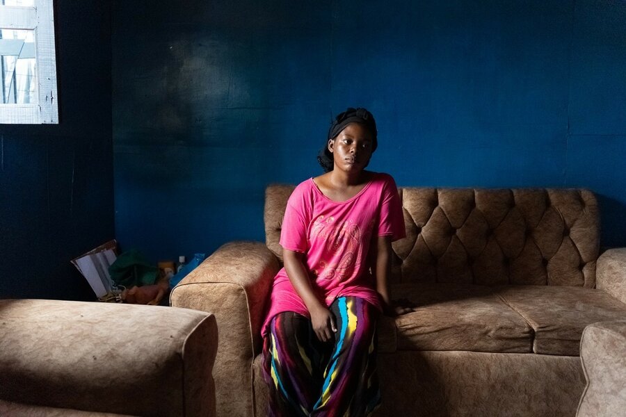 Woman refugee in Kenya on a sofa