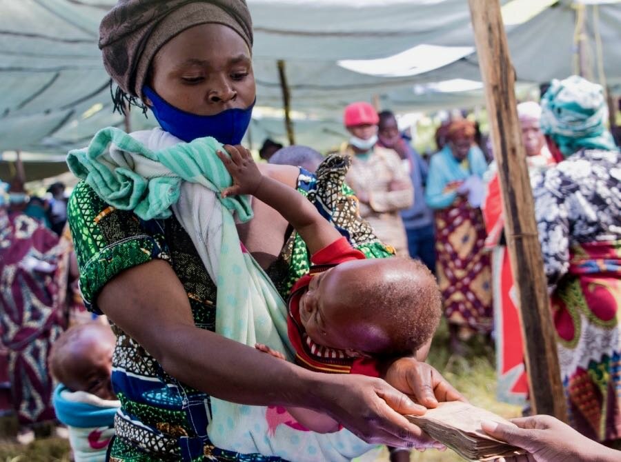 Pendeza receives WFP cash assistance, some of which she hopes to invest in growing crops. Photo: WFP/Benjamin Anguandia