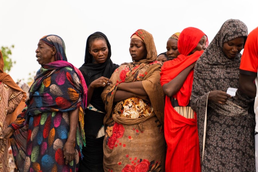 Women await WFP food assistance in Wad Madani, Sudan. The country's crisis is deepening already record hunger levels. Photo: OCHA/Ala Kheir