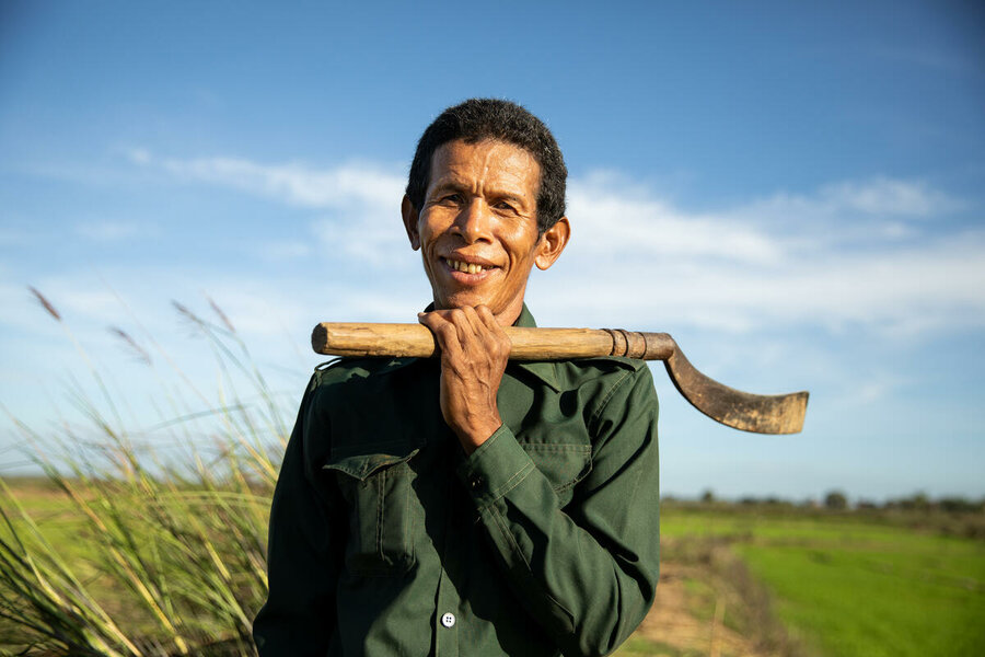 Cambodia. Deur Sok (52) uses his machete to clear the surroundings of his rice paddies in Sambour commune, near Kampong Thom. He relies on the WFP funded canal in the area to keep his rice harvest healthy