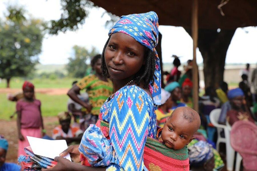 woman in central african republic with son on her back