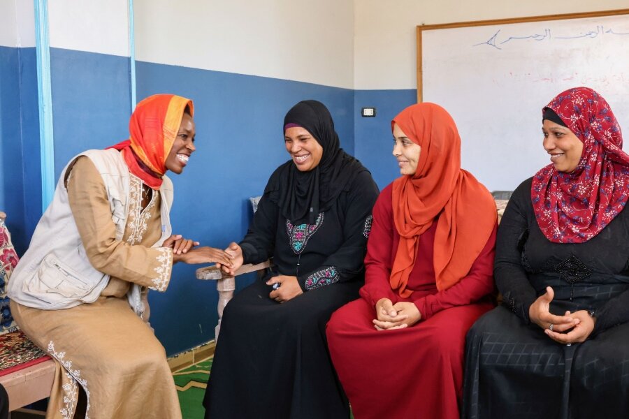 Elizabeth speaks to women in Egypt, where she visited a WFP income generating project that helped to empower them. Photo: Behind the Cause