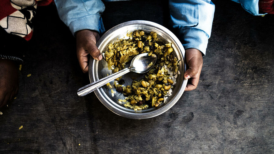 Ganesh primary school cook Pratibha Tamang serves up dishes like blacked-eyed lentils and puffed rice, a favorite with the students. Photo: WFP/Srawan Shrestha