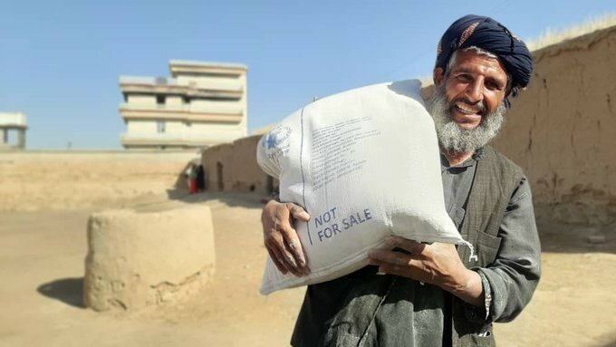 Man holding grain in Afghanistan