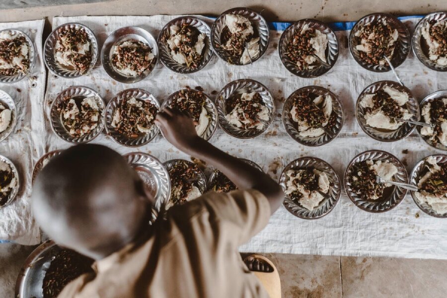 A student in Rwanda serves up meals that are part of a WFP-supported Home Grown School Feeding initiative that sees area farmers supplying the raw ingredients. Photo: WFP/John Paul Sesonga