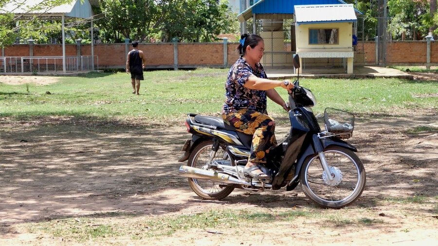Seng's salary as a teacher allowed her to buy a motorbike which she couldn't afford before. Photo: WFP/Edward Johnson.
