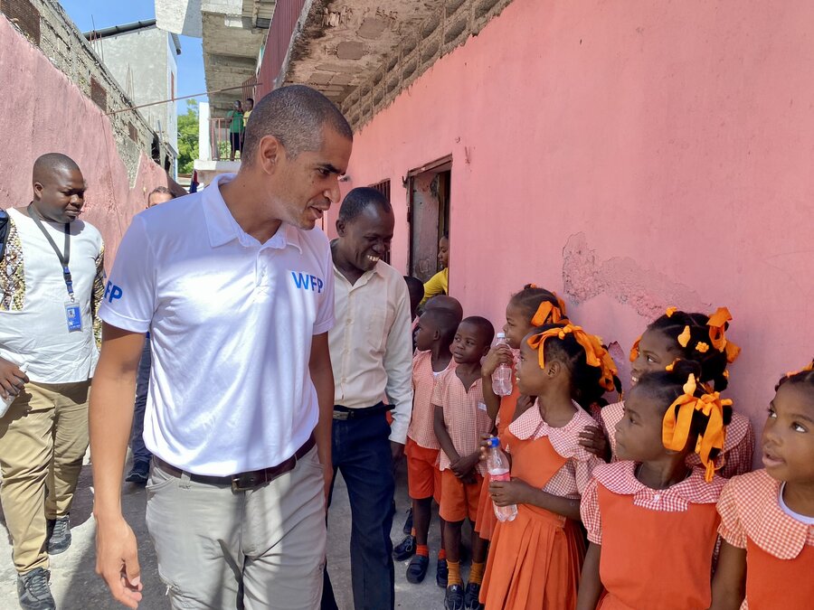 WFP Haiti Country Director Jean-Martin Bauer chats with kids benefitting from WFP school meals in Jeremie, Haiti. Photo: WFP/Tanya Birbeck