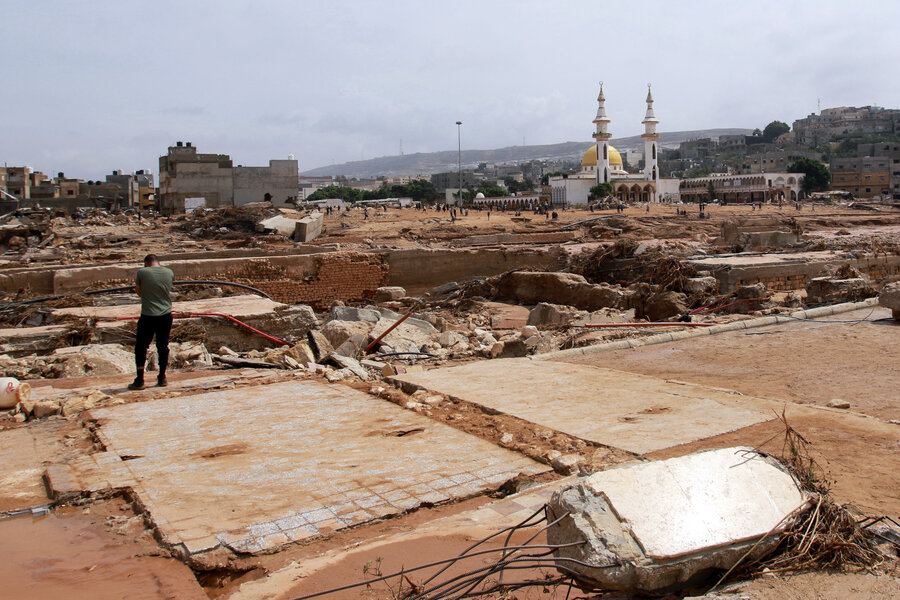 A man surverys damage caused by this week's floods in Derna, Syria