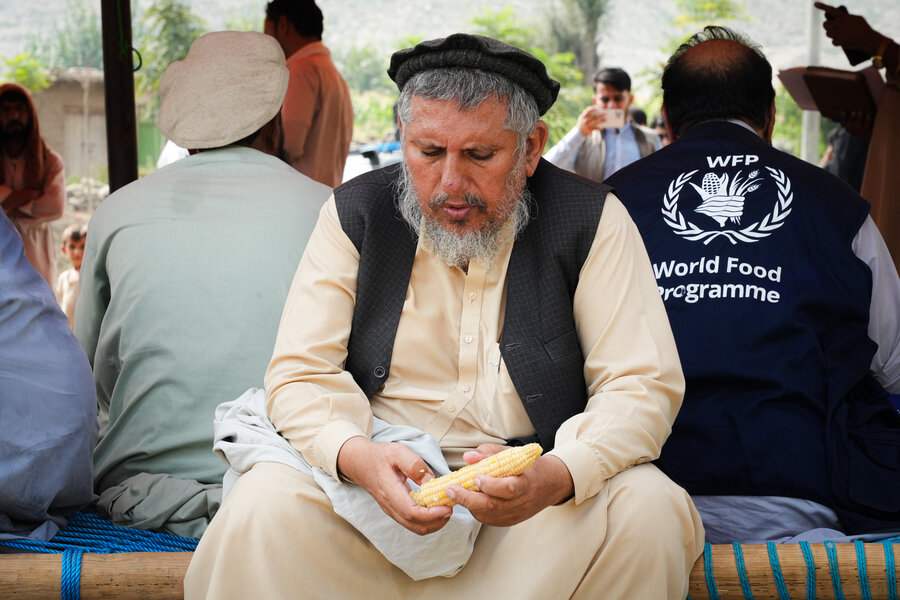 A man eating corn