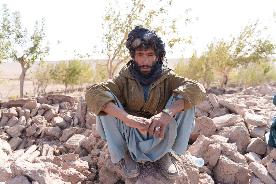 Raza, a shepherd, sits amid the rubble of his destroyed home in Naib-Rafi. Photo: WFP/Hasib Hazinyar