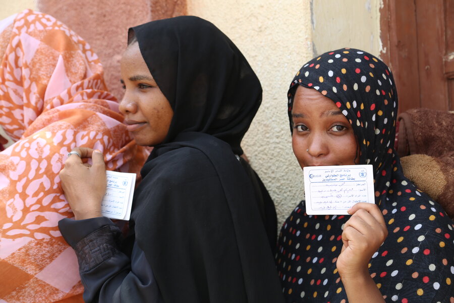 Women line up for WFP food distributions at the Port Sudan university dormitory — which sparked joy, especially among kids. Photo: WFP/Leni Kinzli