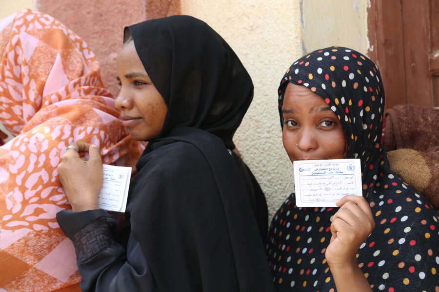 Women line up for WFP food distributions at the Port Sudan university dormitory - which sparked joy, especially among kids. Photo: WFP/Leni Kinzli