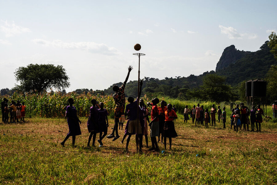Girls playing basketball in Uganda