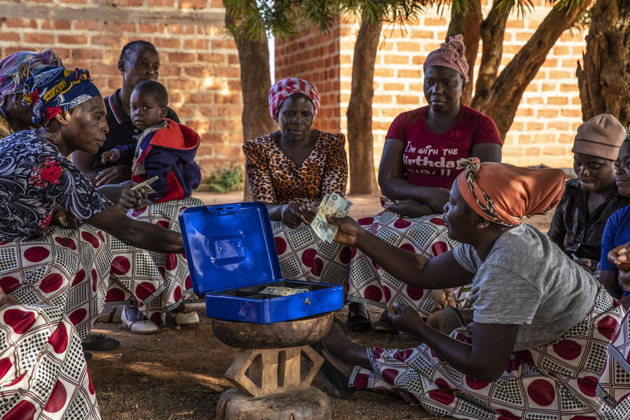 Emelda Hichoombolwa (C) and her all-women savings group use their money to expand their businesses. Photo: WFP/Gabriela Vivacqua