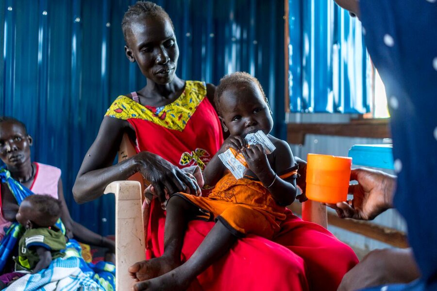 Mothers with infants line up for supplementary foods at a clinic in Rubkona. Photo: WFP/Arete/Fredrik Lerneryd