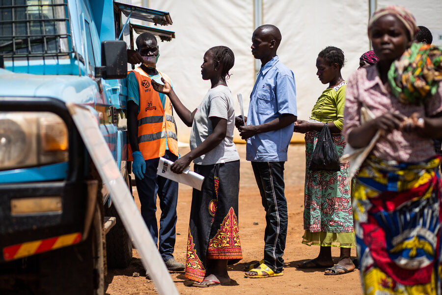 A cash assisytance line at the Kyangwali camp