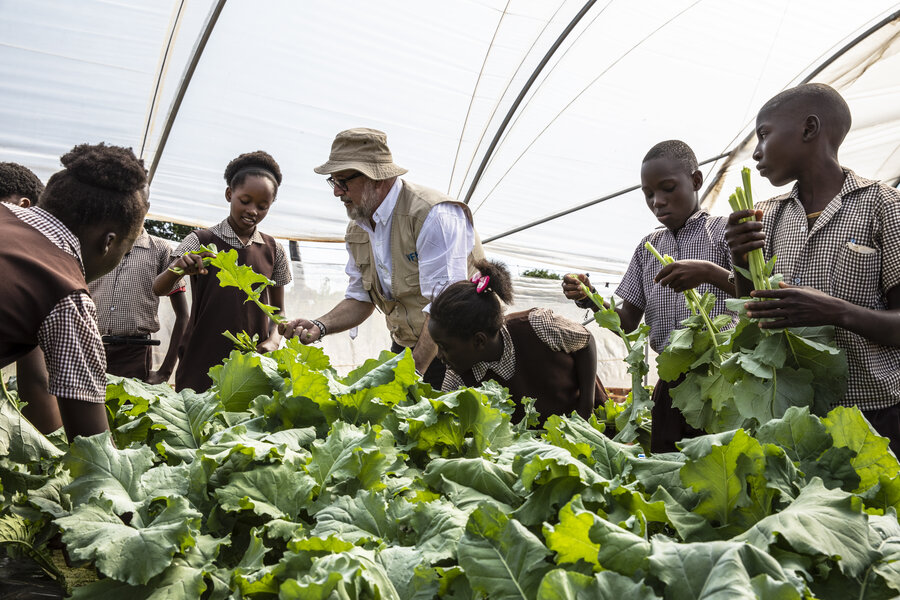 WFP Goodwill Ambassador and celebrity chef Andrew Zimmern checks out the greens grown by students at Gwembe Primary School in southern Zambia