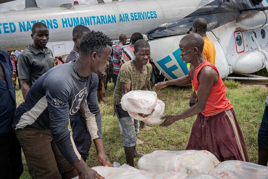 An UNHAS helicopter delivers assistance to in Phalombe district in Malawi cut off by Cyclone Freddy in March 2023. Photo: WFP/Badre Bahaji