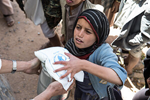 a girl is taking WFP food