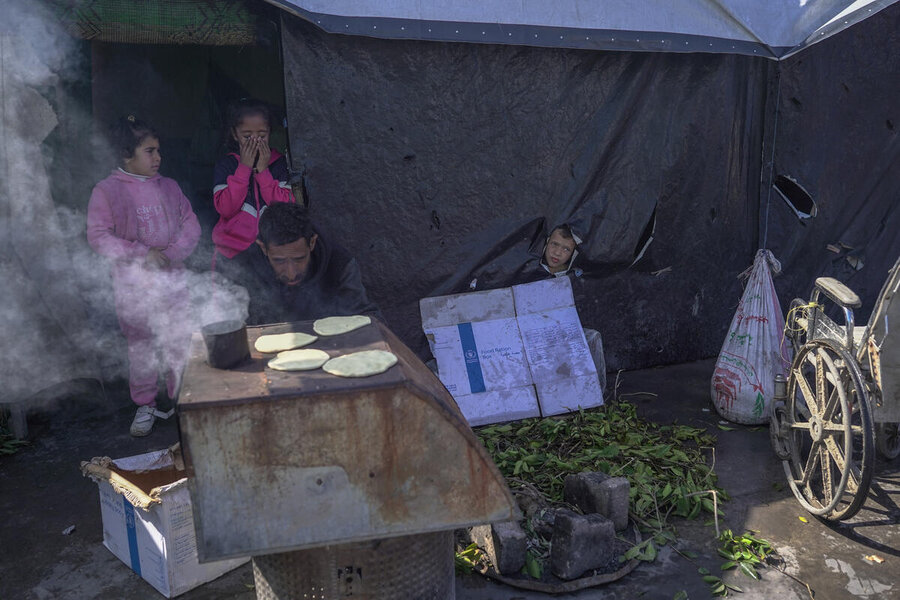 Brave face: Abdallah and his family fled Sabra for Deir El Balah where they stay in a leaky tent. They have barely any clothes or water and there is one mattress between eight people. One of his siblings has a foot infection. Photo: WFP/Jaber Badwan