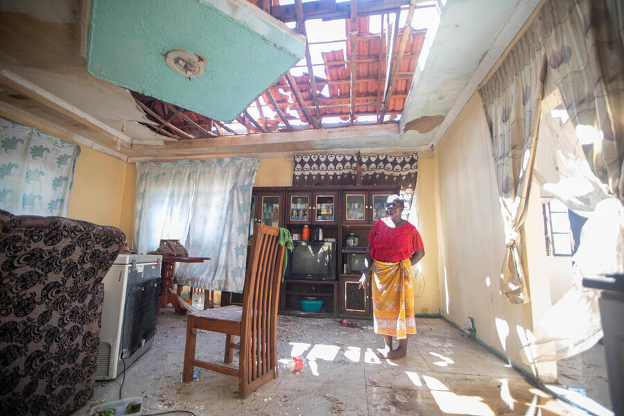 A woman assess damage to her home caused by tropical storm Filip in Morrumbene district, Inhambane province, Mozambique. Photo:Alfredo Zuniga