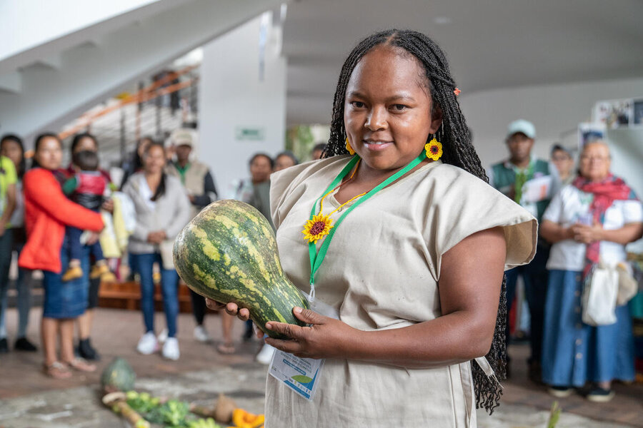 Afro-descendant Colombian woman holds gourd