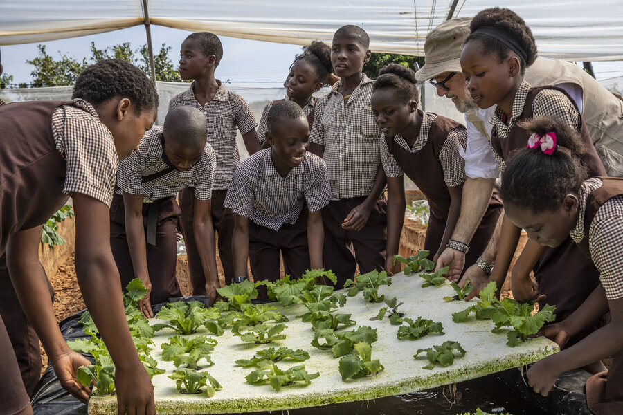 Chef Andrew Zimmern with schoolchildren at a hydroponics project in Zambia