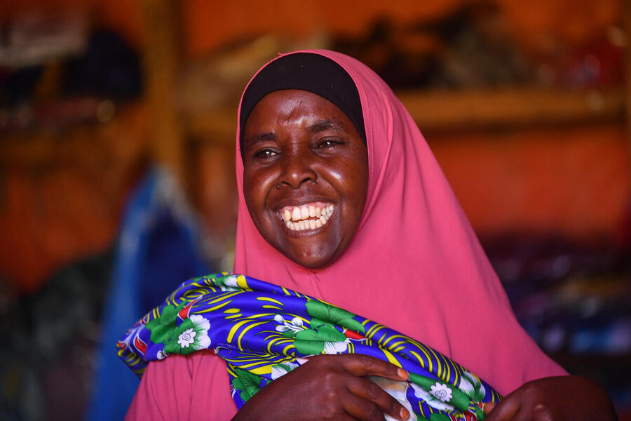 Trader Una Ibrahim Mahmoud has set up a clothing business at Hilaweyn refugee camp, where her cooperative includes refugees and local Ethiopians like herself. Photo: WFP/Michael Tewelde
