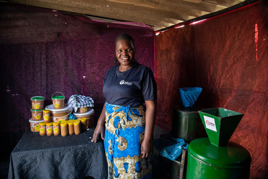 Nedebele with her extracting machine and products