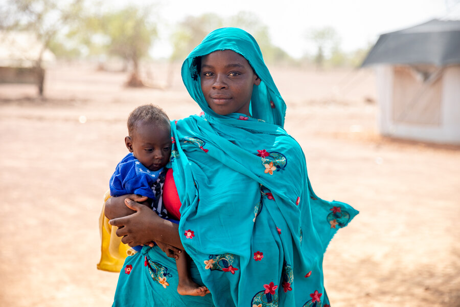 Sudanese refugees Zahara and her daughter Moona, who is recovering from malnutrition with WFP nutritional supplements. Photo: WFP/Eulalia Berlanga 