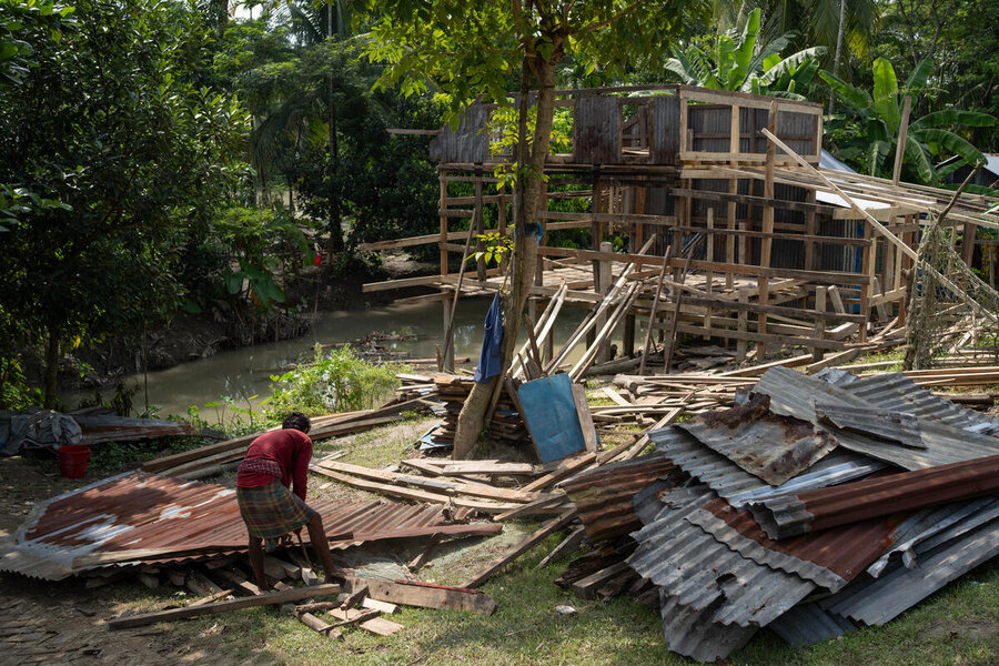 A man repairs his home after cyclone Remal, as part of WFP's cash-for-work programme. Our support reached tens of thousands of people hit by storms and floods this year. Photo: WFP/Mehedi Reman