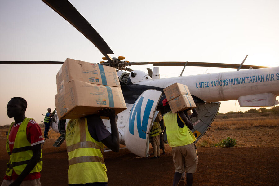 A WFP helicopter is loaded with boxes