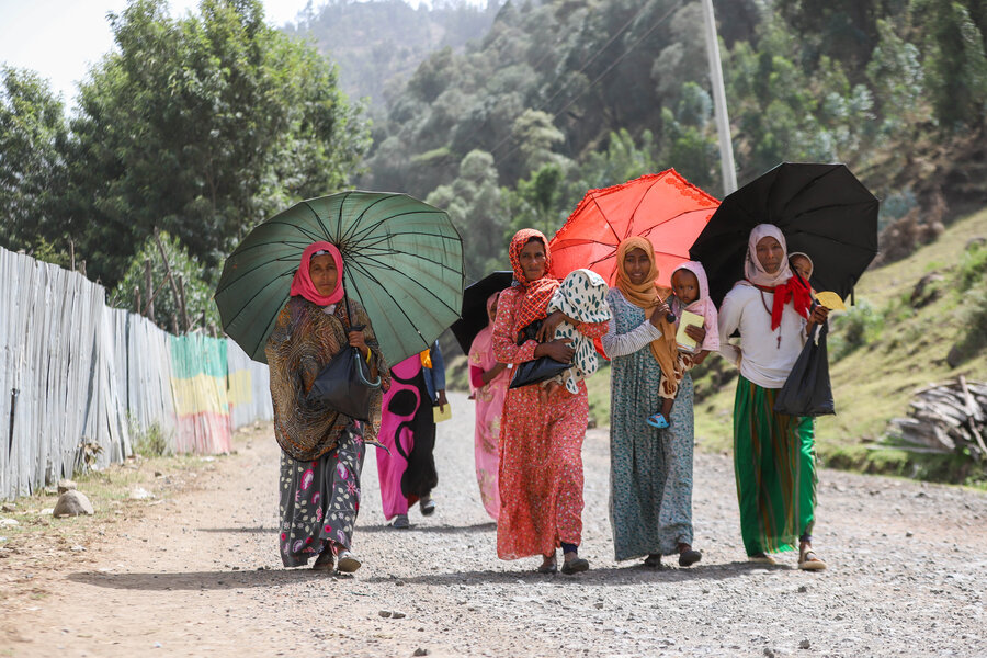 Women in Ethiopia's Amhara region head to a health post that receives WFP nutritional support. The assistance is part of a broader, Government-run campaign to prevent malnutrition and encourage healthy habits. Photo: WFP/Michael Tewelde