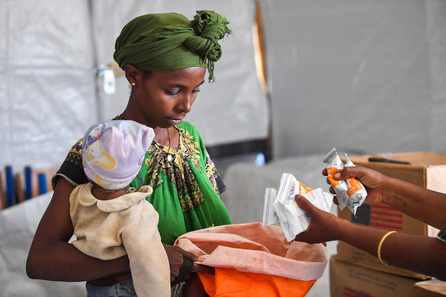 Belaynesh Berihu receives WFP-supported specialized nutritious foods at a health post in Ethiopia's northern Tigray region. Photo: WFP/Michael Tewelde
