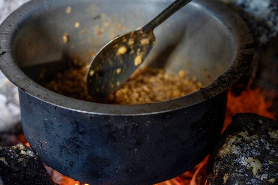 A pot of vegetable stew simmers over a makeshift stove in eastern DRC. WFP may be forced to halve our assistance amid a funding crunch - even as the country faces record hunger. Photo: WFP/Benjamin Anguandia