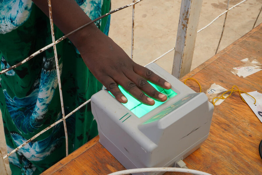 A refugee undergoes fingerprint identification at Kakuma before receiving WFP support. Photo: WFP/Martin Karimi
